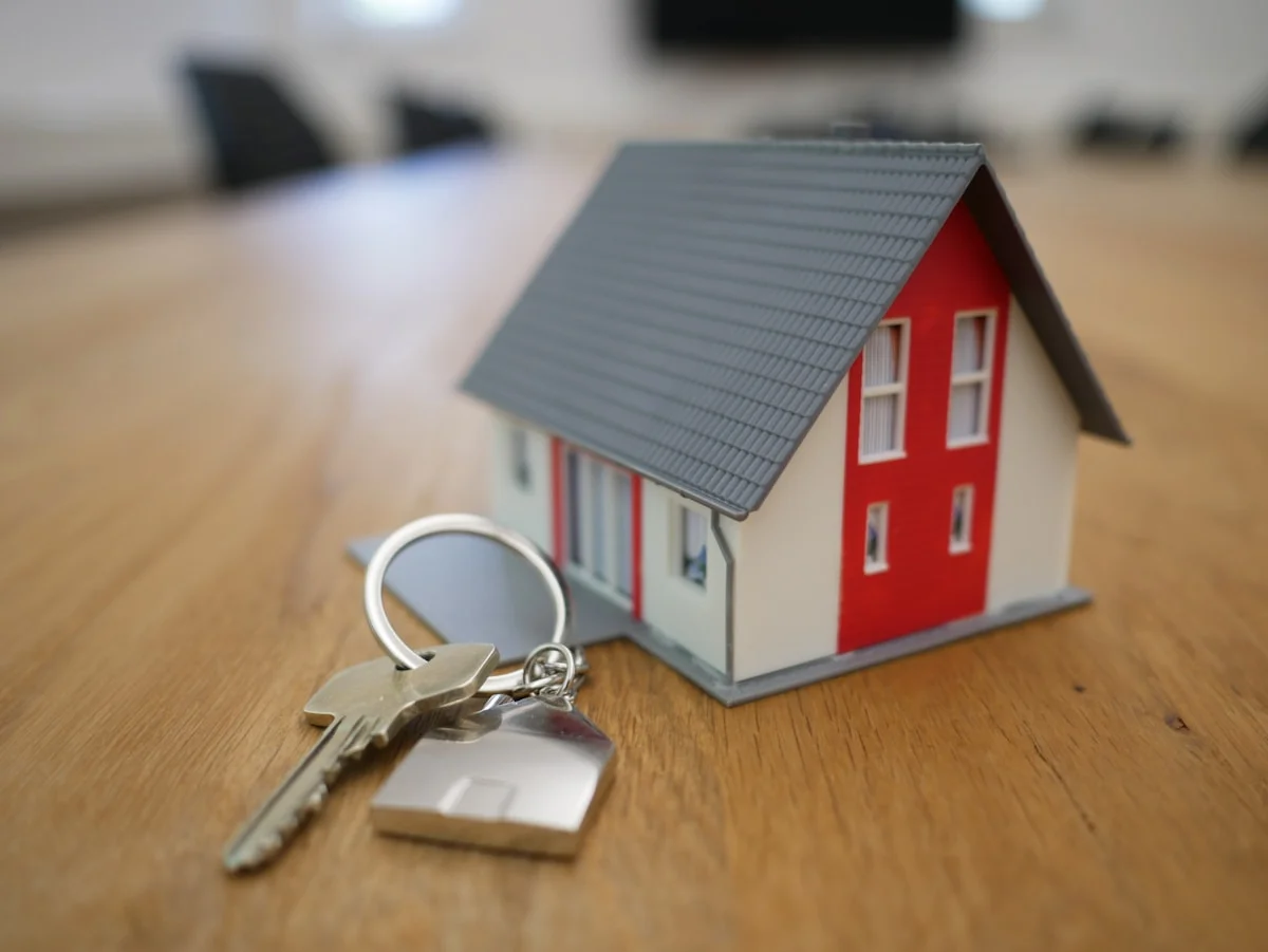 Property house model with keys representing buyer's agent services